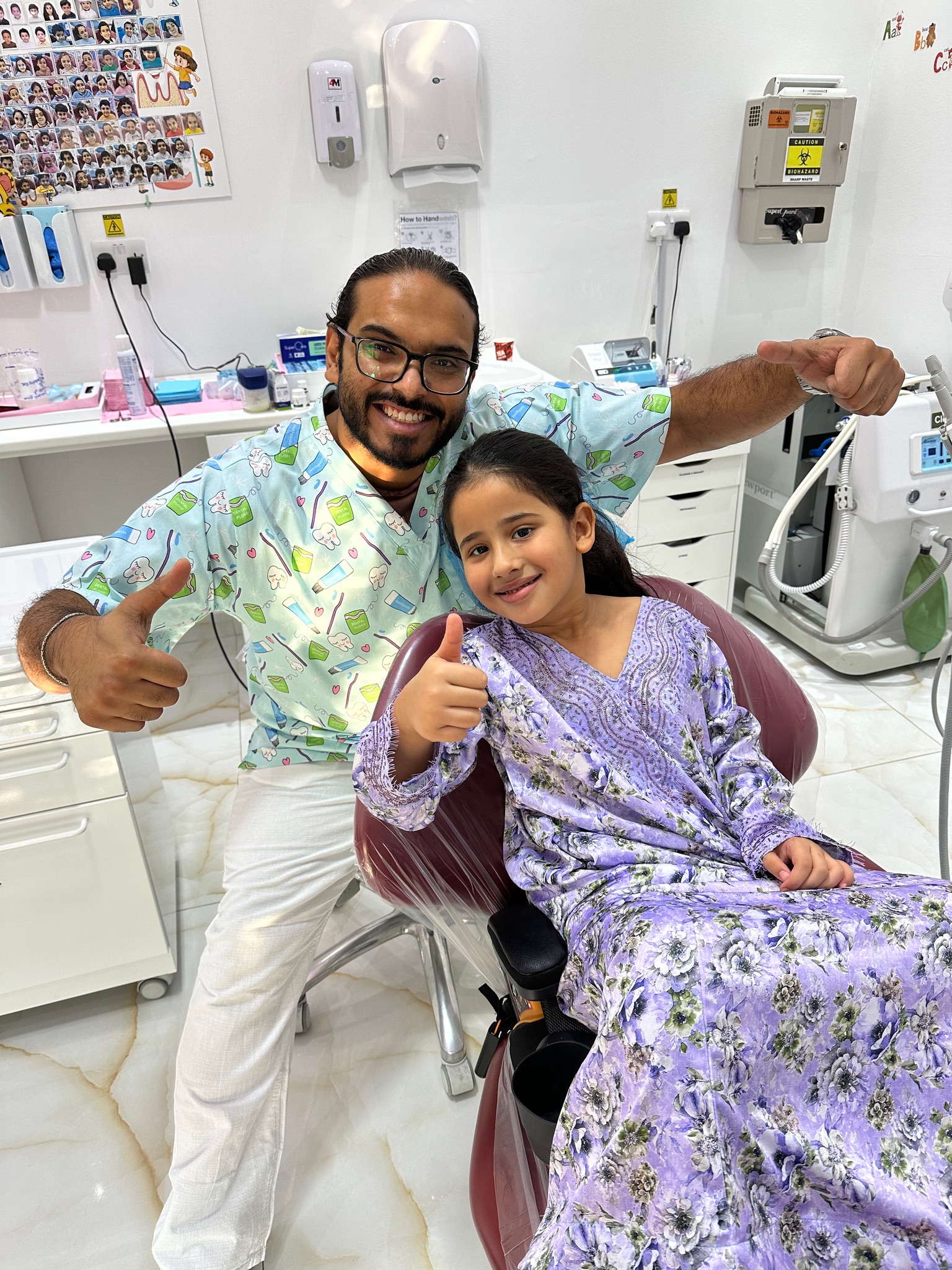 Happy child after dental visit with Dr. Mohsen Alozaibi